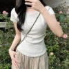 The design style is niche, straight shoulders, cotton crew neck, short-sleeved T-shirt, women's summer showy, short waist, slender and versatile - White-gray [round neck]